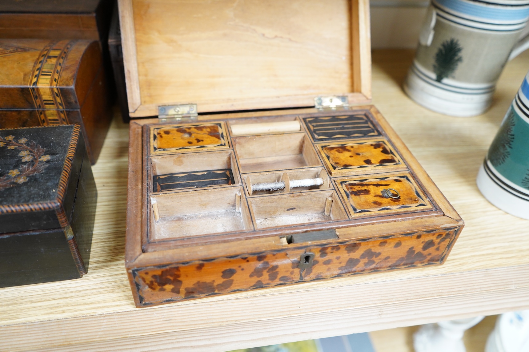 A blonde tortoiseshell veneered box, six other boxes and a miniature bagatelle board